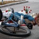 Illustration for article titled Community Places Candles, Flowers Atop Spot Where Cyclist Currently Bleeding Out